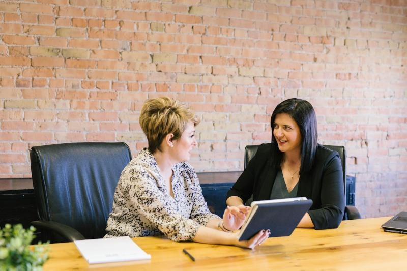 Advisor reviewing a plan with a client on a tablet